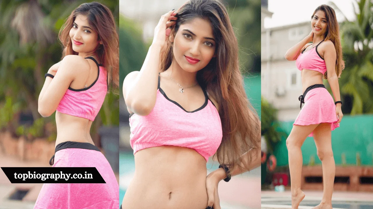 Angel Rai in pink outfit